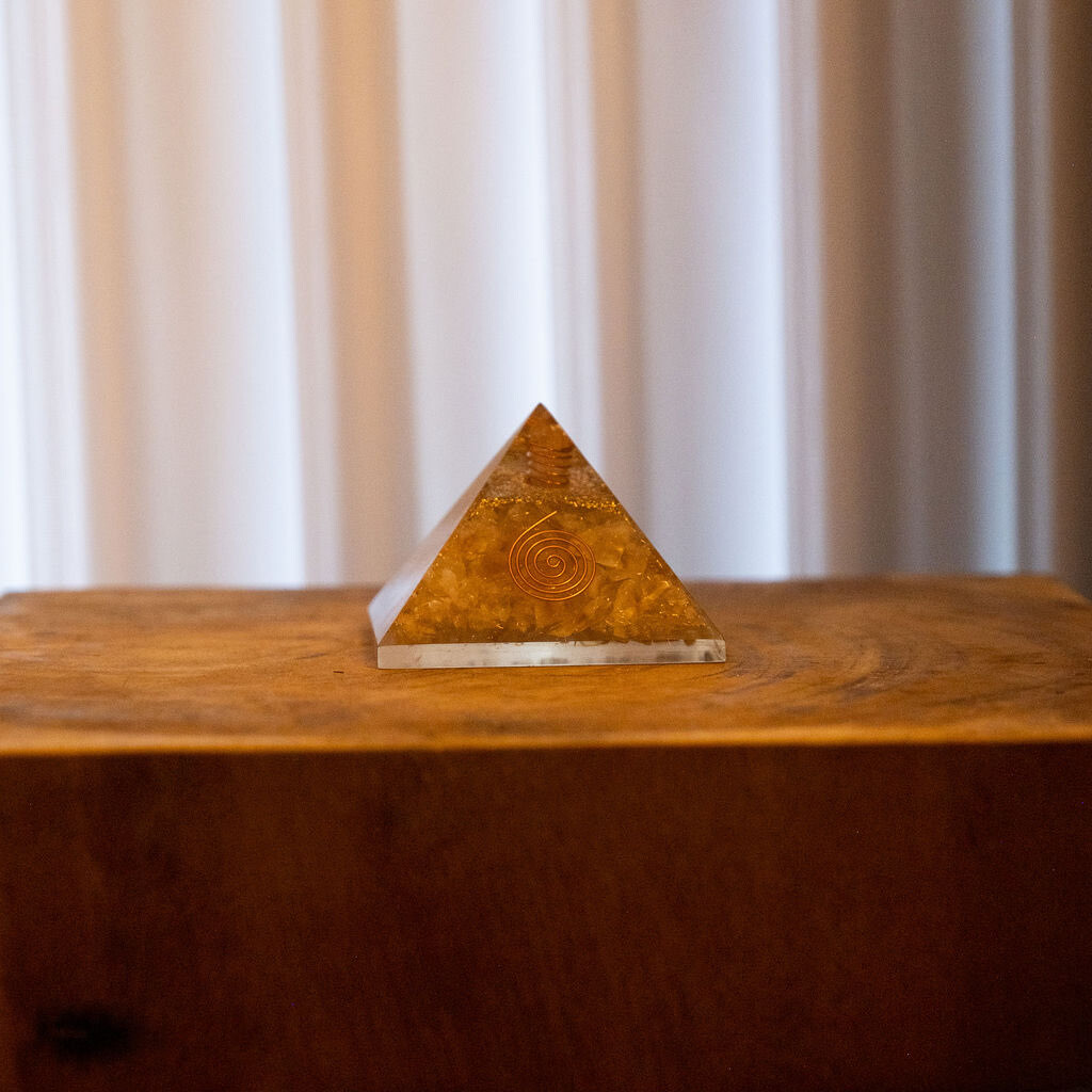Golden pyramid representing tailored energy solutions - Custom Feng Shui